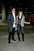 Milla Jovovich and Paul W. S. Anderson at Los Angeles International Airport