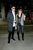 Milla Jovovich and Paul W. S. Anderson at Los Angeles International Airport