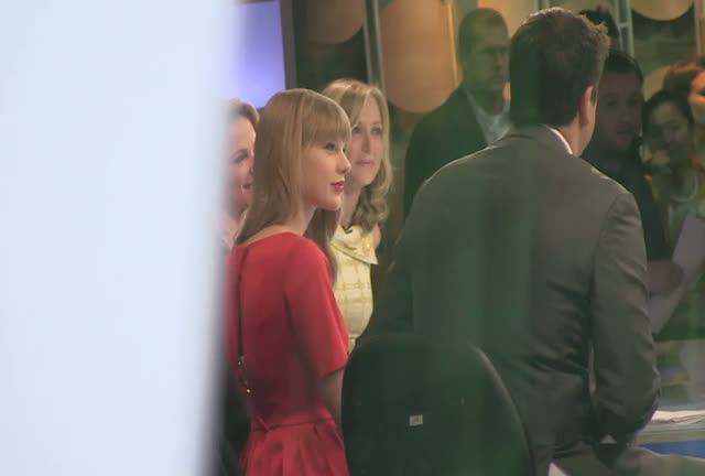 Taylor Swift Stuns Fans In Gorgeous Red Dress As She Does Autographs On Leaving GMA