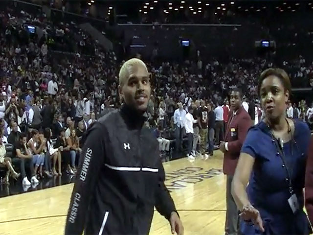 Chris Brown And Rihanna Seen During The Warm-Up For Charity Basketball Game - Summer Classic Charity Basketball Game Part 3