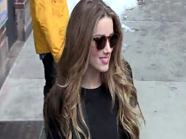 Amber Heard Totters Across Icy Street Outside 'Letterman' Studios