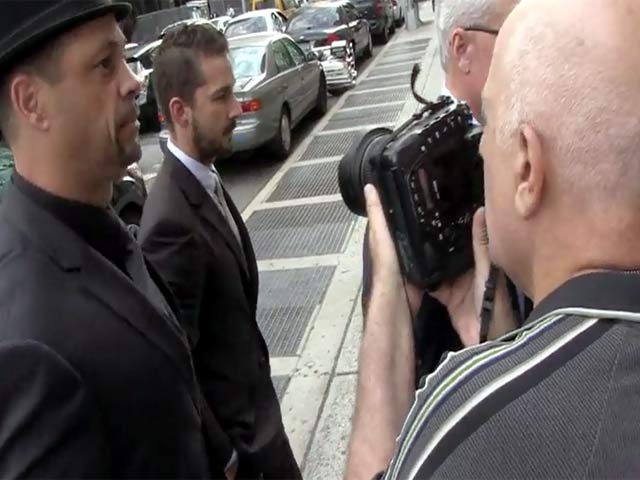 Shia LaBeouf Struggles Past The Surging Paps As He Arrives Outside Manhattan Criminal Court